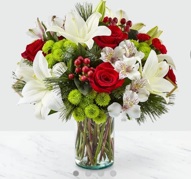 Christmas spirit bouquet - Make the most of the holiday season with a bouquet that captures the spirit of Christmas. Our local florists design this fresh arrangement with classic shades and modern texture.