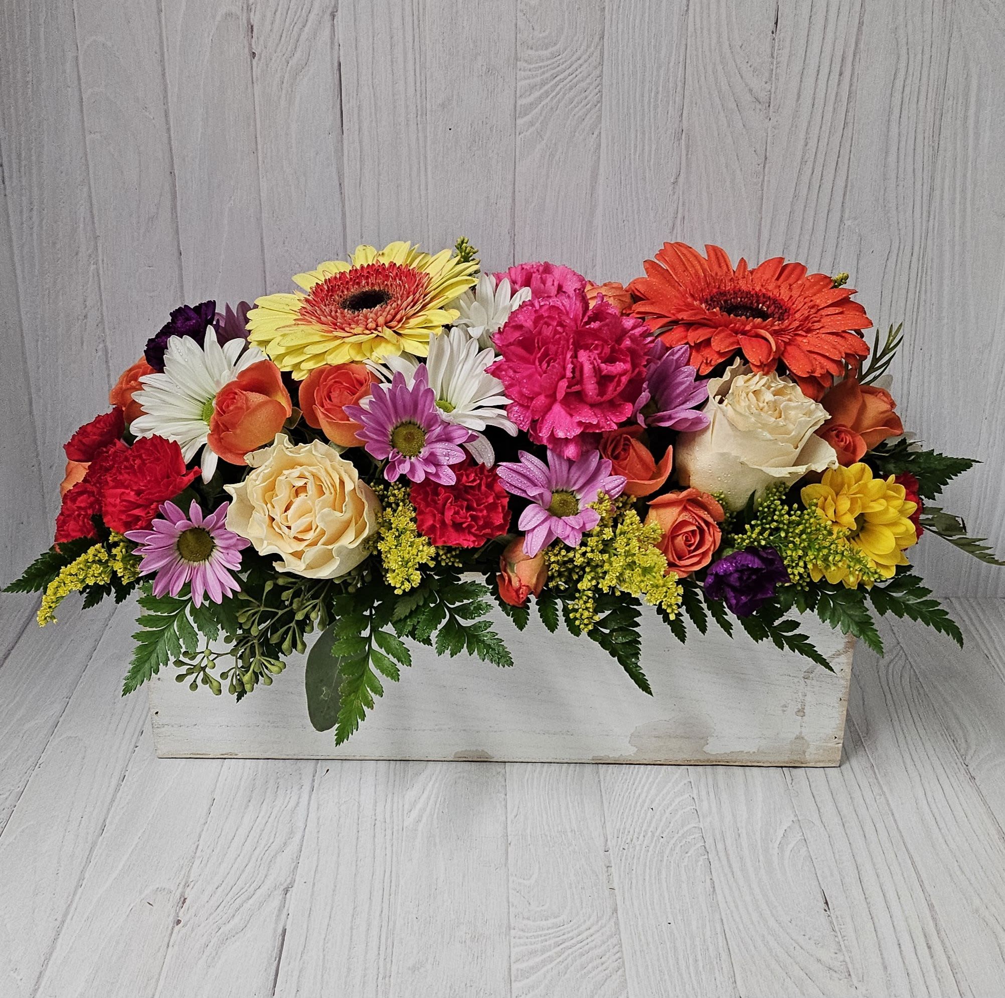 Bright Days Container Mix - Keep things fun with this jewel toned flower box! Our most seasonal flowers in a wooden garden box of various sizes give this arrangement its bright colors and textures to create a beautiful centerpiece or gift.      APPROXIMATE DIMENSIONS 18&quot; W X 10&quot; H