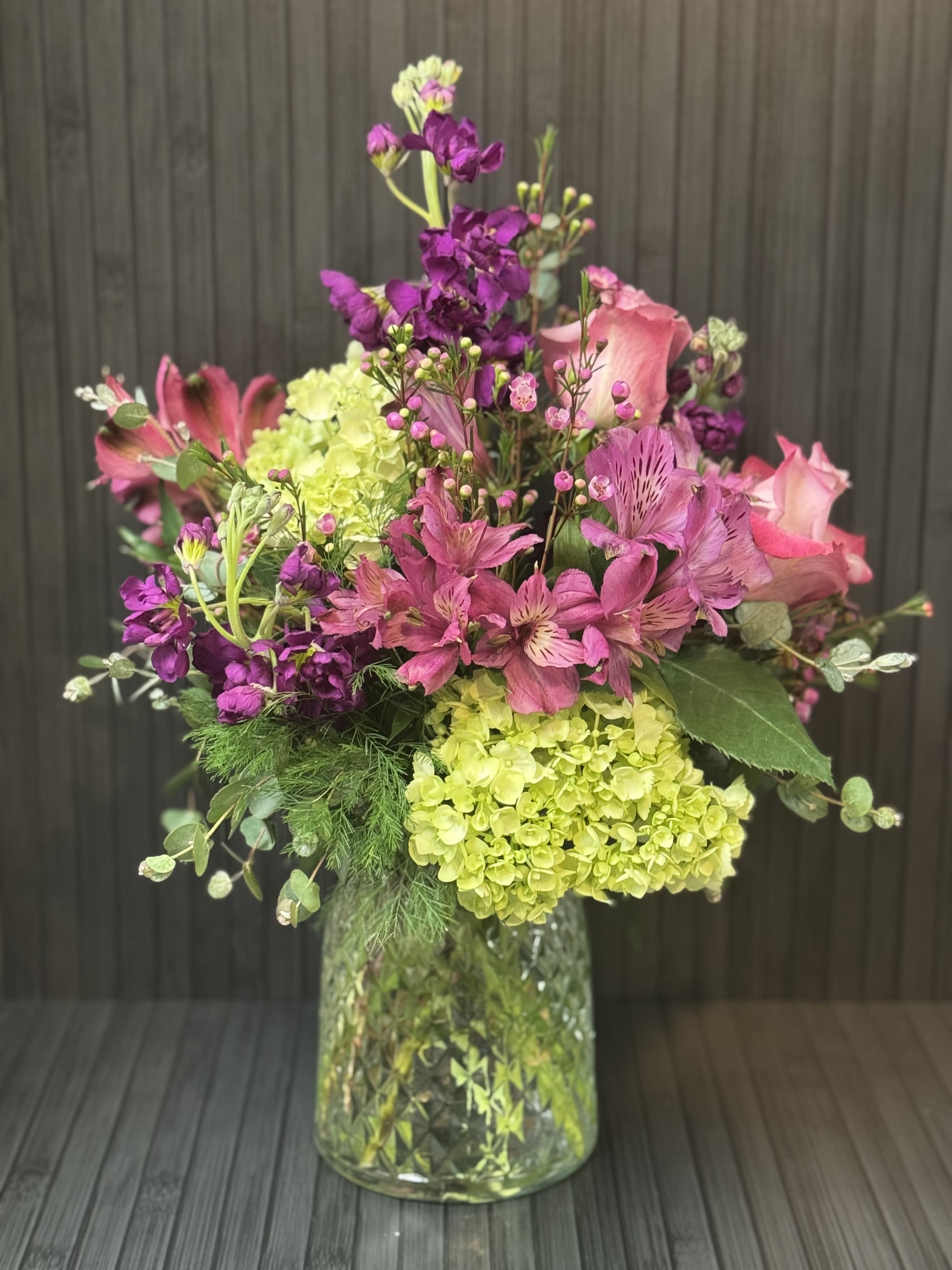 Blooming Betty - A beautiful collection of Hydrangea, Roses, Stock, Alstro, Premium Greenery and Filler will be a favorite of all who receive!  This vase will change seasonally with the colors but flowers will remain a constant!  A must have!