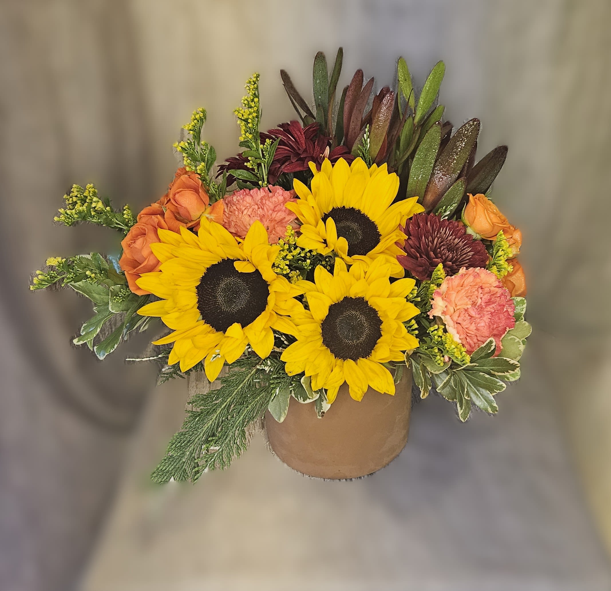 Sunlit Splendor - This dynamic fall centerpiece brings the autumn colors and textures to your table, just in time for Thanksgiving!