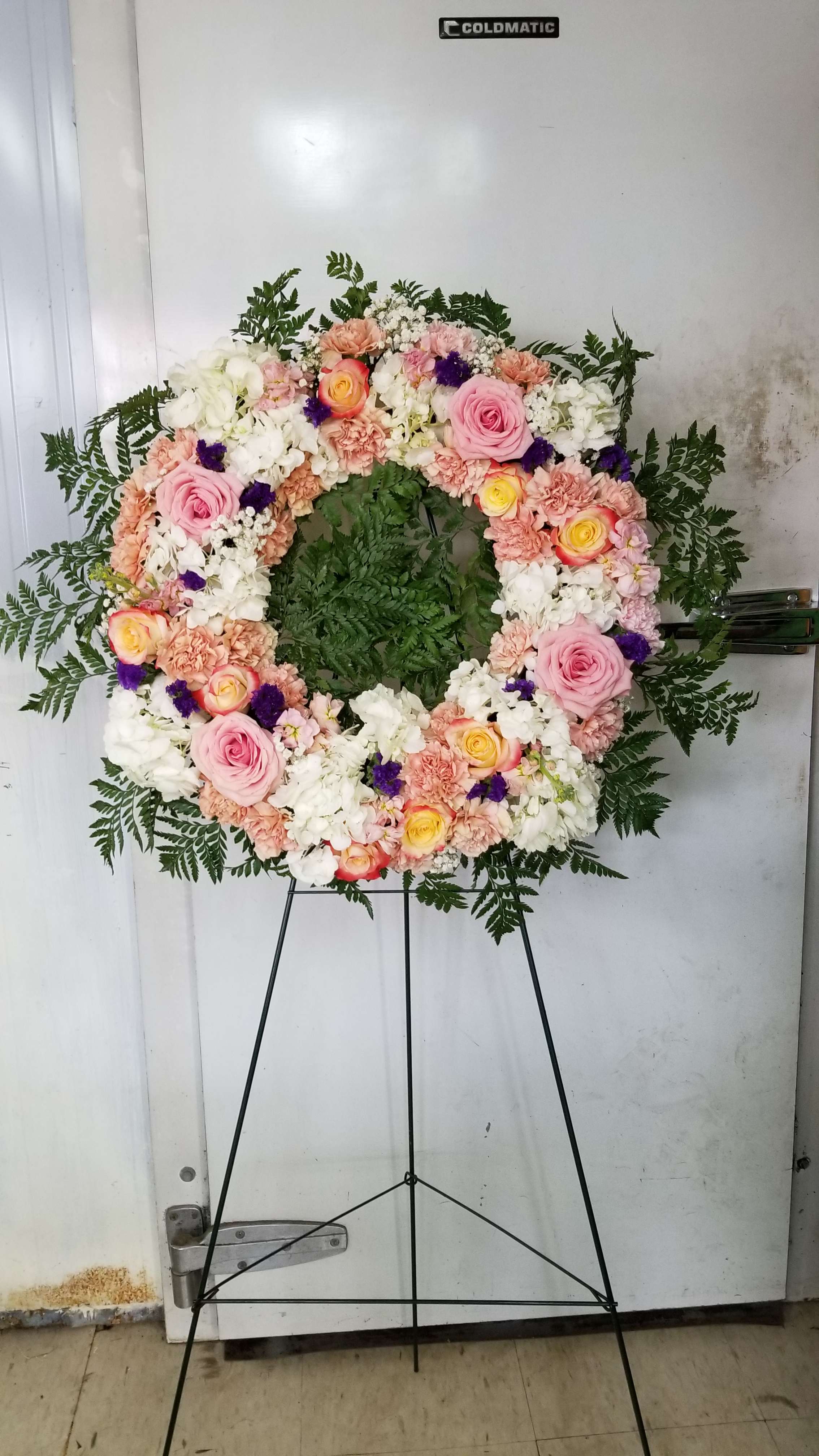 Designers Choice Circle Wreath - The circular shape of a wreath symbolizes continuity and eternity, reminding us of the circle of life 