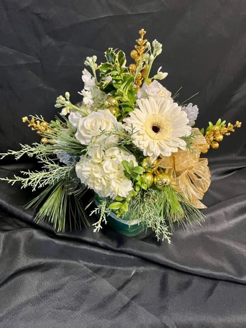 Holiday Elegance - Silver and gold accents with stunning white roses, hydrangea, gerbera daisies, and stock surrounded by elegant winter greens. 