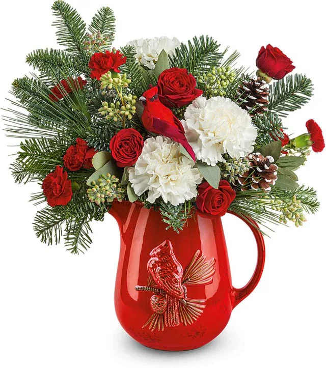Scarlet Cardinal Bouquet - Bring nature’s own holiday symbol indoors with Scarlet Cardinal arrangement. This festive bouquet pairs seasonal flowers with a lifelike cardinal perched among winter foliage, evoking the joy and serenity of the season. It’s a poetic and unique way to express warm wishes this Christmas.