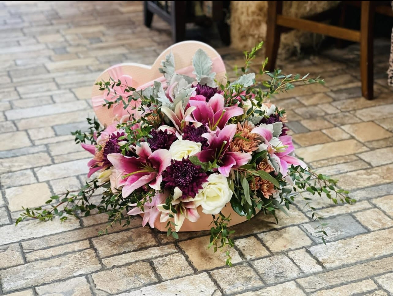 Lily Luxe Box - This exquisite arrangement features premium handpicked lilies, artfully placed within our signature luxe box to create a breathtaking display of soft sophistication. Each bloom is chosen for its graceful form, delicate fragrance, and radiant freshness—bringing serenity and refined charm to any space.