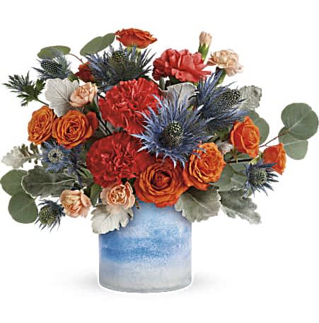 Standout Chic Bouquet - Tres chic! This high-fashion mix of bold orange roses and eye-catching blue eryngium, arranged in a frosted art glass vase, is a stand-out gift for any occasion!