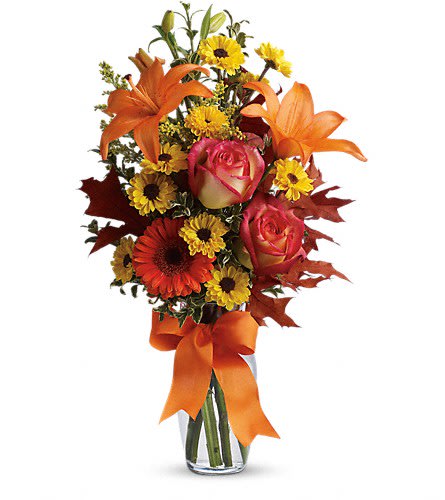 Burst of Autumn - by Flowers by Dreama Dawn - A burst of beauteous blooms in autumn shades of orange and yellow is mixed with a handful of oak leaves then delivered in a clear glass vase adorned with a bright satin ribbon. A splendid gift for birthdays or any fall occasion. A mix of fresh flowers such as Asiatic lilies Viking spray chrysanthemums roses and a miniature gerbera - in shades of orange and yellow - is arranged with preserved oak leaves in a clear glass vase adorned with an orange satin ribbon.Approximately 8" W x 19" H Orientation: One-Sided As Shown : TFL02-2ADeluxe : TFL02-2BPremium : TFL02-2C