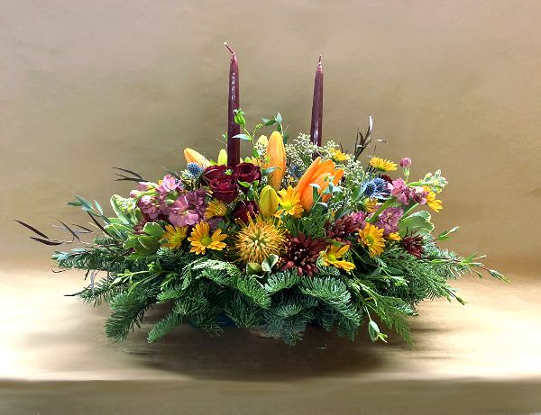 Grateful Glory Centerpeice - Enhance your dining table with this glorious centerpiece consisting of warm autumnal colors topped off with a pair of burgundy taper candles.