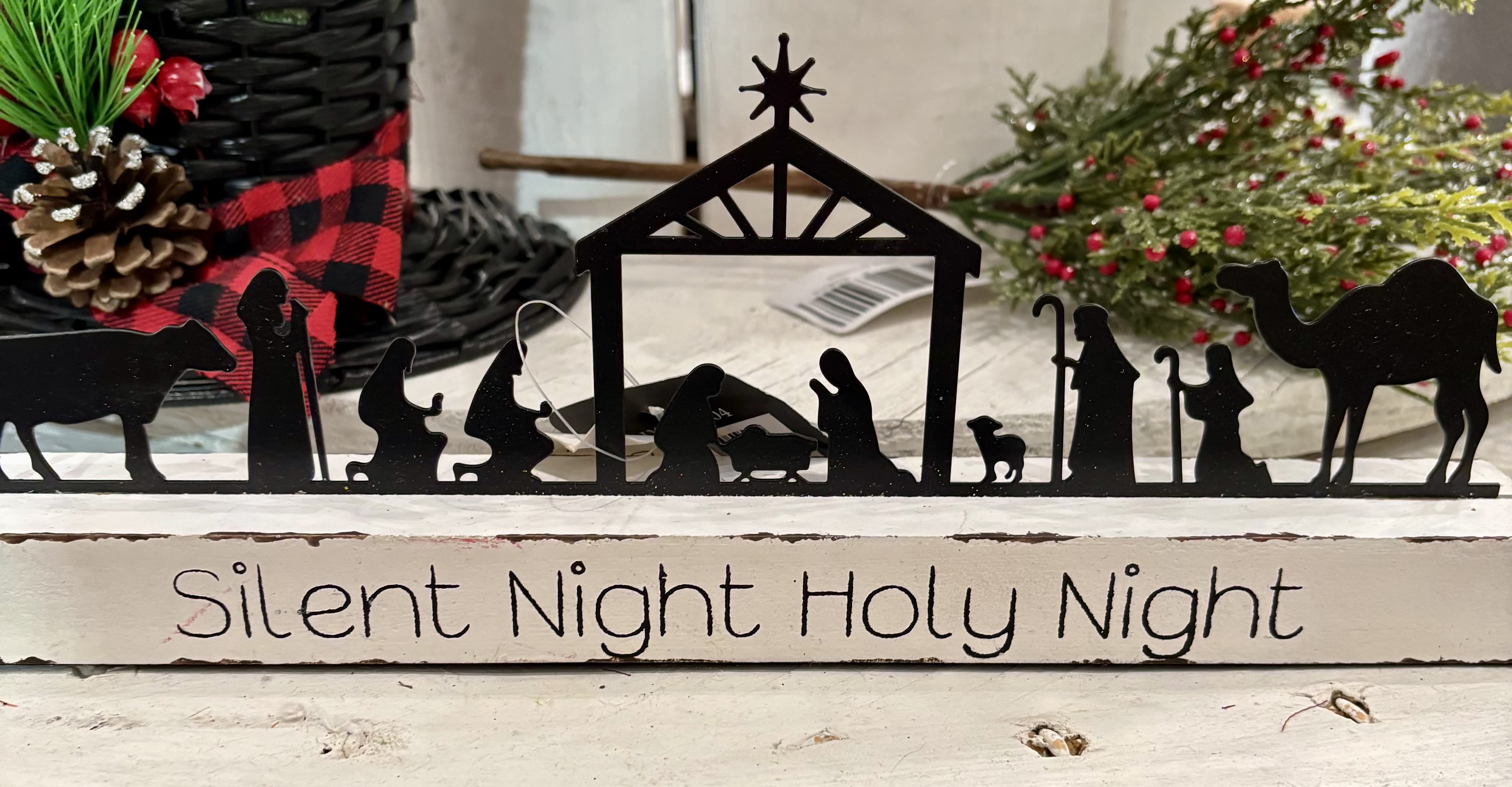 Silent Night Holy Night - Silent Night, Holy Night, Nativity Silhouette display A beautiful reminder of the true meaning of Christmas, this metal nativity silhouette sits atop a wooden base engraved with Silent Night Holy Night.   Approx 12&quot; long x 4.5&quot; tall