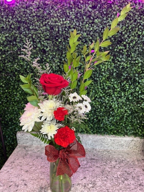 Beautiful reds - Make this custom or keep the beautiful red roses, white viking daisies, and cushion poms! 