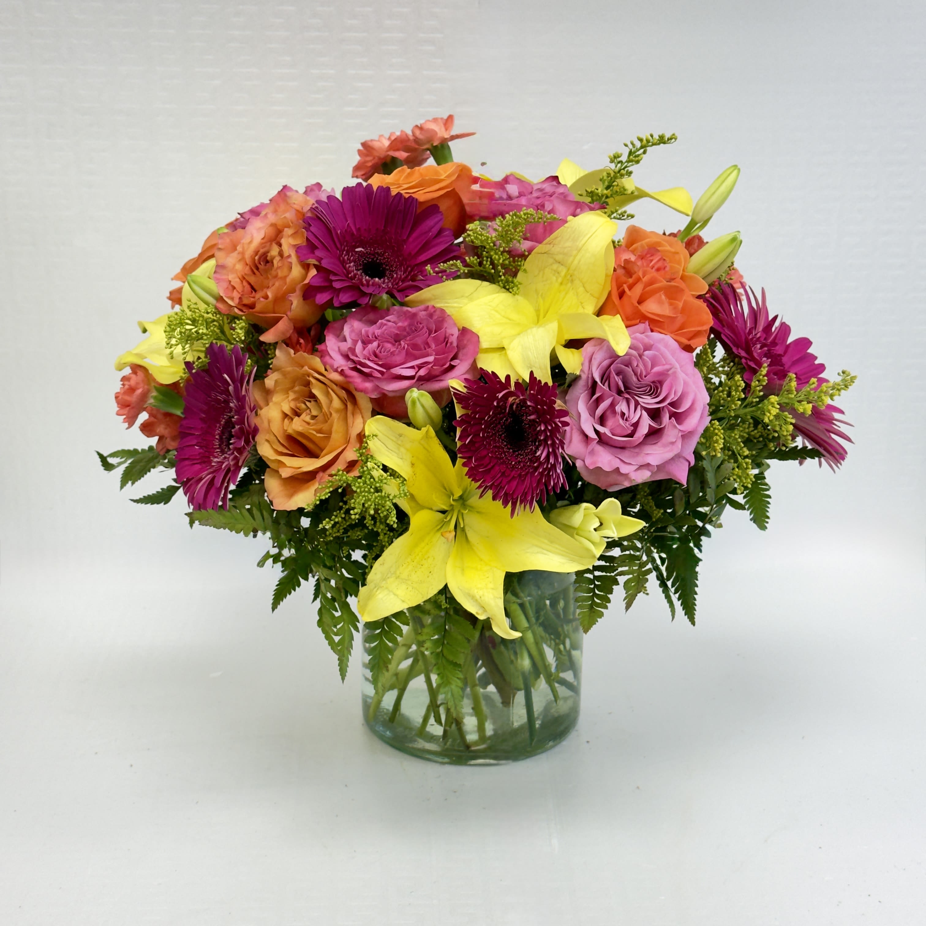 Bright &amp; Bold Bouquet - A cheerful mix of vibrant yellows, pinks, purples, and oranges, this lively arrangement brings instant joy to any room. Perfect for birthdays, celebrations, or simply adding a burst of color to someone’s day.