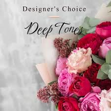 Deep Tones - Beautifully deep-toned flowers in a nice container. Medium sized with natural texture and seasonal blooms.