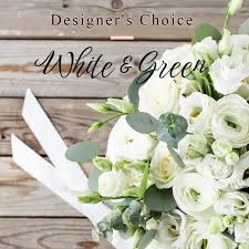 White and Green - A gorgeous mixture of white and green seasonal blooms in a nice container.