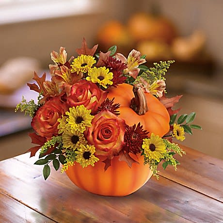  Warm Fall bouquet - orange roses, orange alstroemeria, burgundy cushion chrysanthemums, yellow daisy chrysanthemums, solidago, huckleberry and oak leaves. 