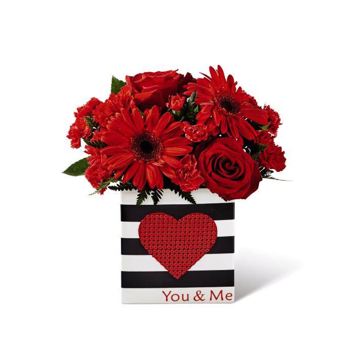 The FTD Be Loved Bouquet - Love is in the air this Valentine's Day! The FTDÂ¨ Love You XOÂª Bouquet by Hallmark is the perfect way to celebrate the loves in your life, whether it be your sweetheart, a favorite family member, or your best friend. Pink Asiatic Lilies capture their attention with their large star-shaped blooms set against a blushing backdrop of red roses, red mini carnations, hot pink carnations, hot pink gilly flower and lush greens. Arranged with a loving hand within a keepsake frosted glass vase with a pink and red heart design throughout, this Valentine flower bouquet is presented with a Hallmark tag that reads, "Love You!" on one side and, "XO, XO, XO," on the other to create a beautiful way to celebrate love this coming February 14th. GOOD bouquet includes 9 stems. Approx. 14"H x 12"W. BETTER bouquet includes 12 stems. Approx. 16"H x 13"W. BEST bouquet includes 15 stems. Approx. 17"H x 14"W. EXQUISITE bouquet includes 20 stems. Approx. 18"H x 15"W.