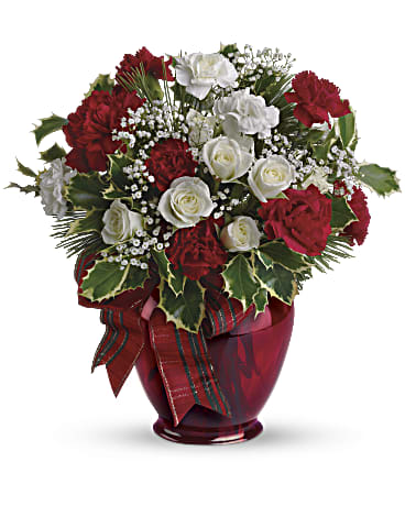 Holiday Splendor Bouquet - All dressed up in classic Christmas colors, this holiday floral arrangement is delivered in a delightful ruby red vase tied with a festive ribbon. This bouquet is the perfect way to wish your loved ones a Merry Christmas! Approximately 12 inches wide and 12 inches tall for the Standard size.