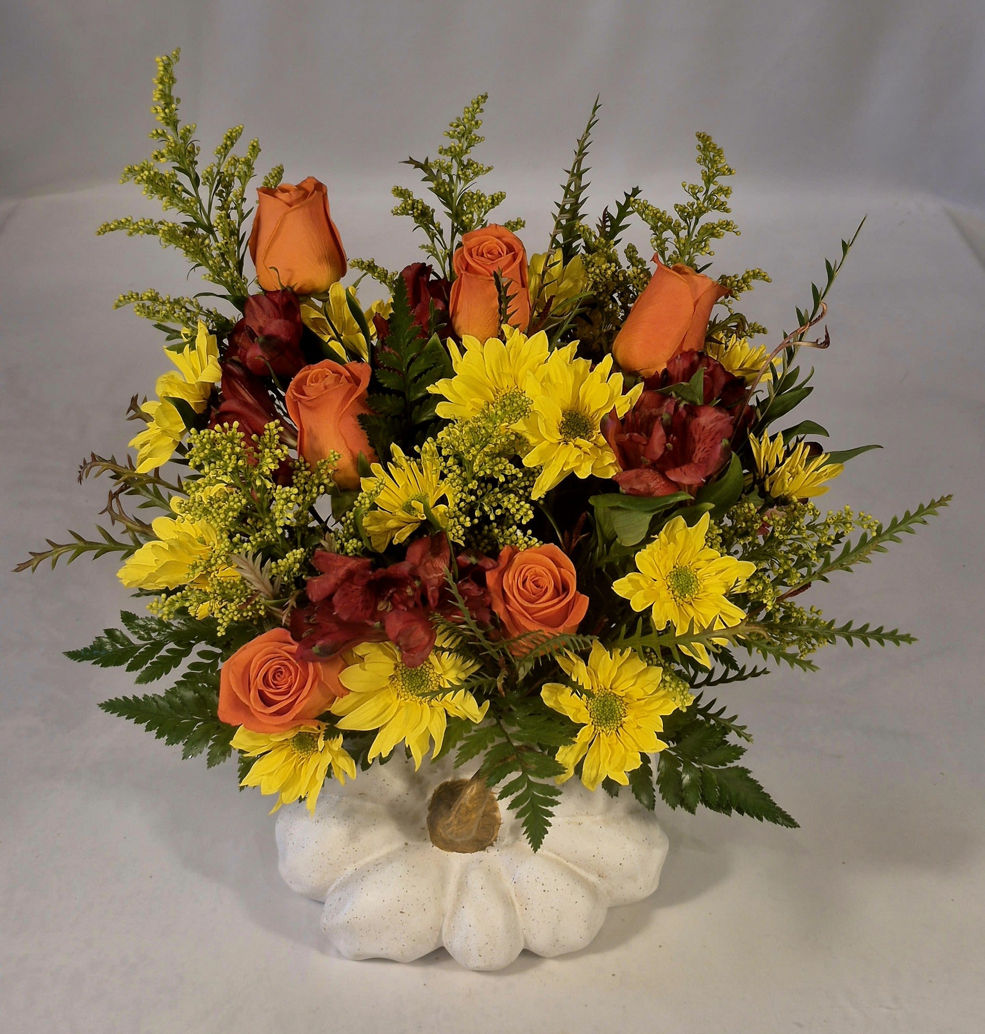 White Pumpkin Bouquet  - A vibrant fall arrangement of golds and oranges in an elegant white ceramic pumpkin is the perfect one sided centerpiece for a fall feast. 