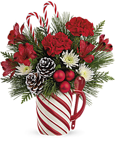 Sweet Stripes Mug Bouquet - Warm their hearts with this sweet holiday bouquet, arranged in a hand-painted ceramic mug with sculpted stripes and a matching spoon! It's food safe so your loved one can use it for their holiday drinks all winter long. Approximately 11 1/2 inches wide and 13 1/2 inches tall for the Standard size.