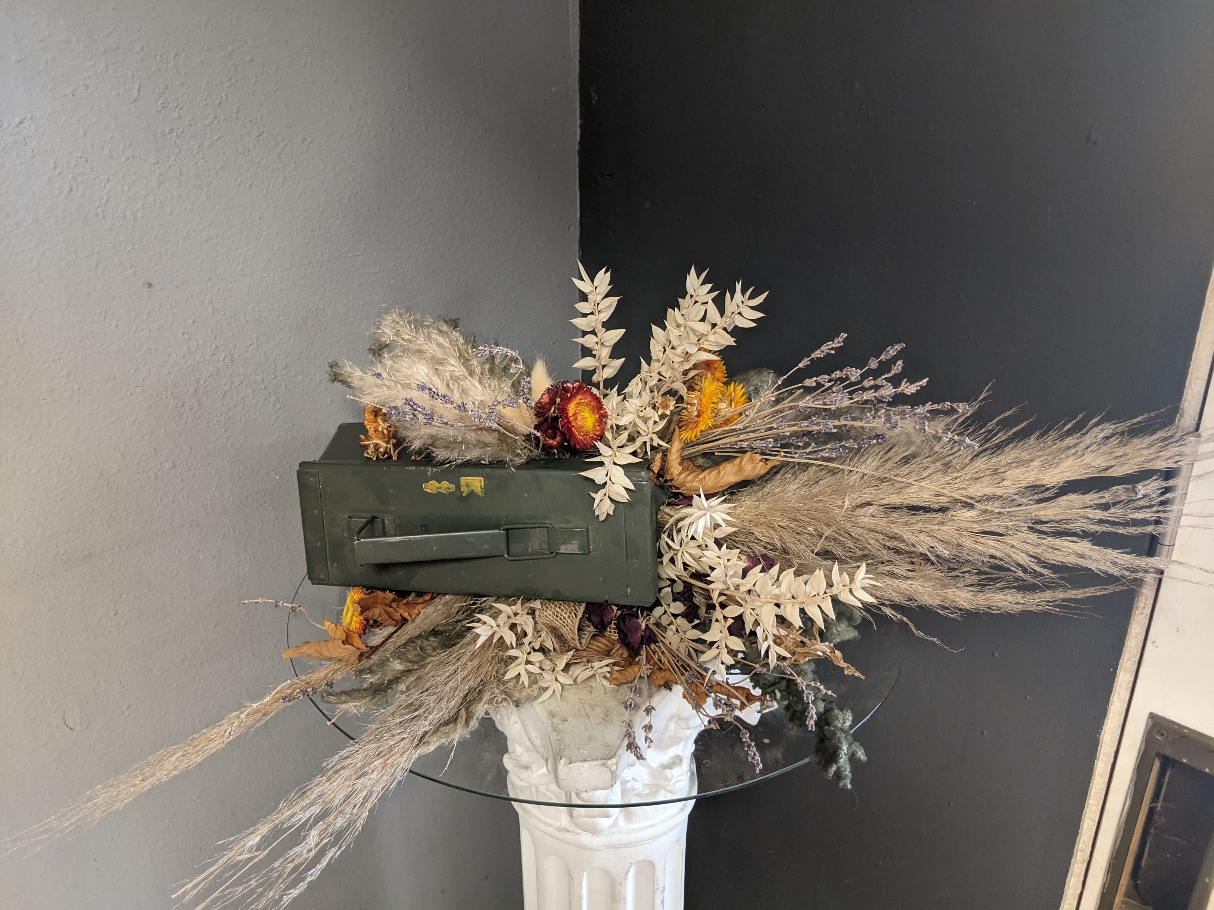 Ammunition Box Dried Arrangement  - This one of a kind dried arrangement is bursting with dried floral