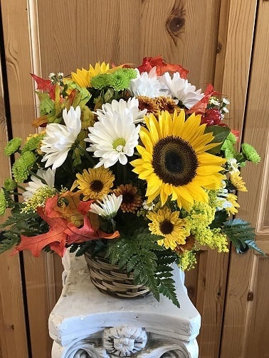 Basket of Fall Blooms - Basket arrangement containing sunflowers, mum, soldaster, wheat and fall leaves.