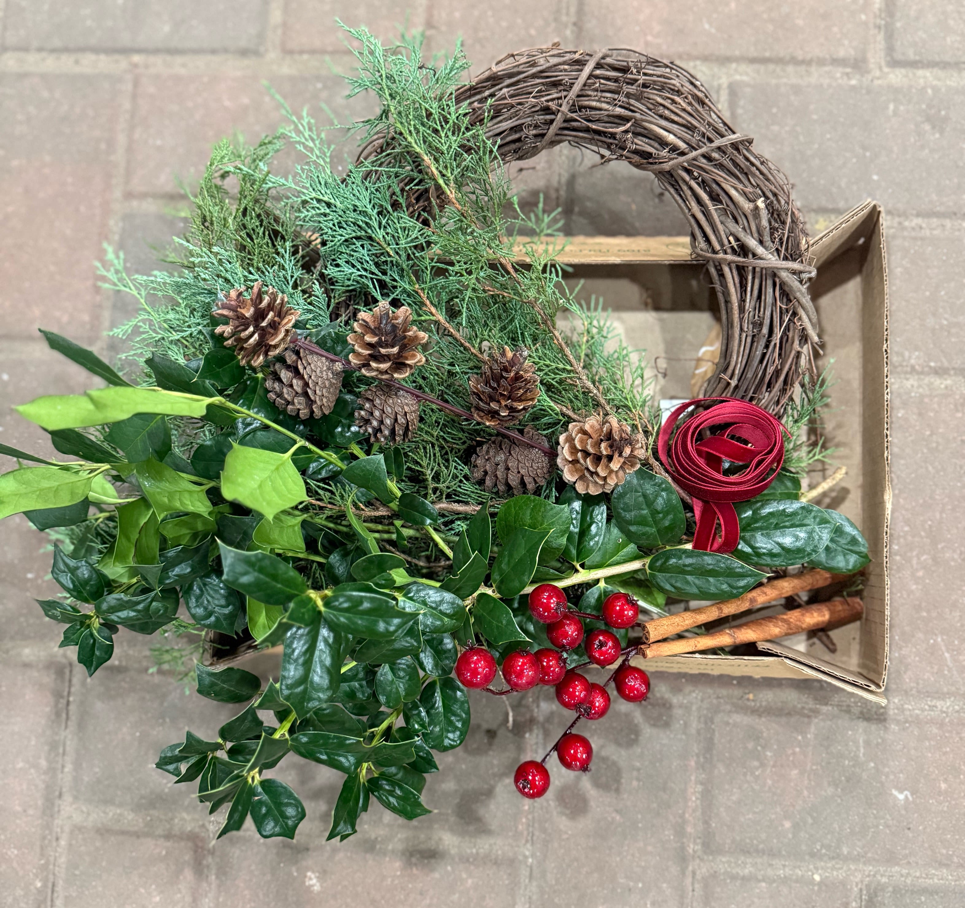 Holiday Wreath Kit - Create your own holiday wreath with fresh evergreens, pine cones, berries and accents. 