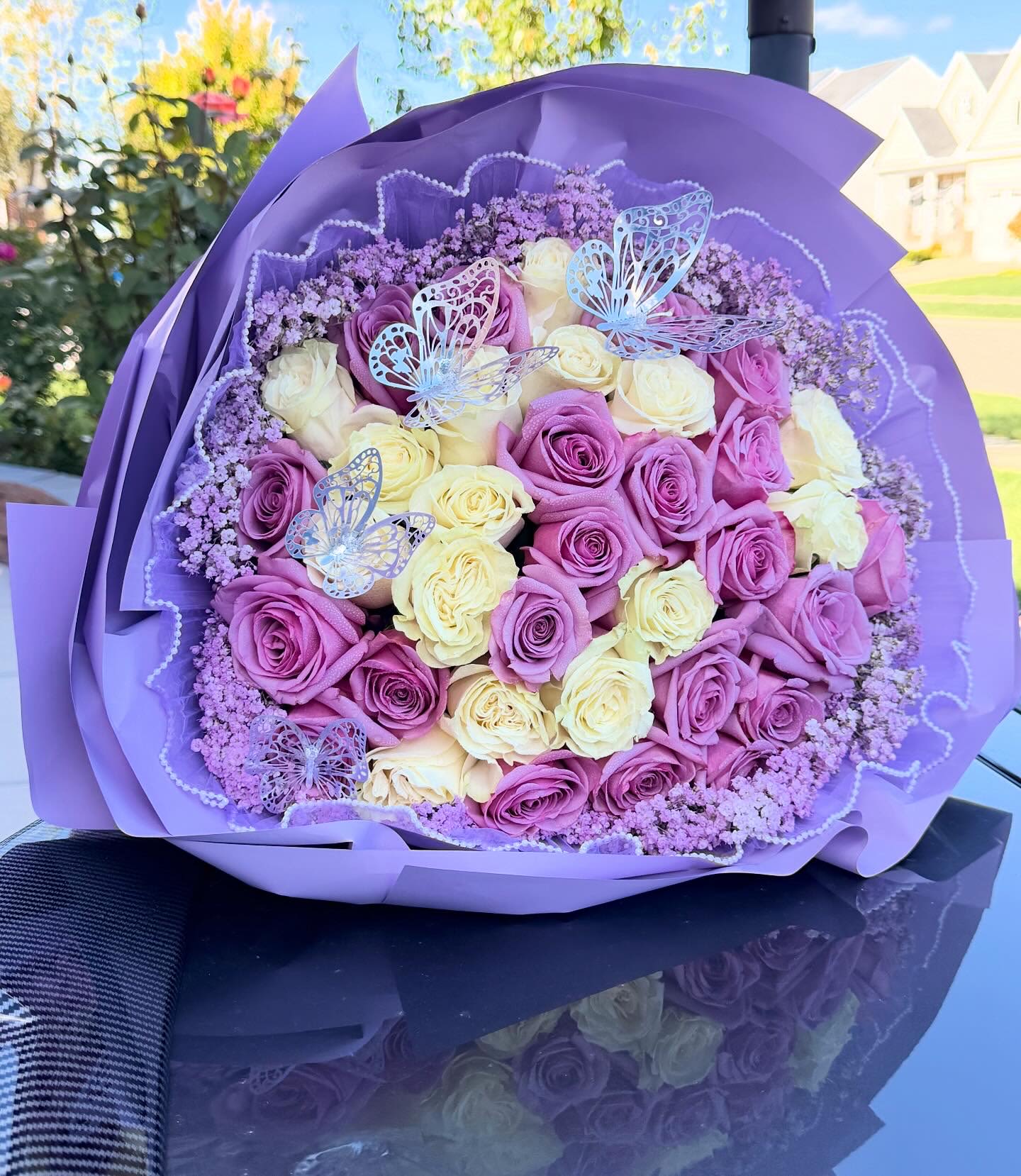 Purple with white  - Purple and white roses hand wrapped any color wrap available.