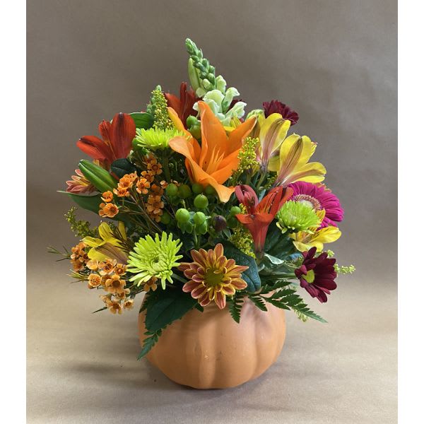 Pumpkin &amp; Petals - A spicy mix of autumn colors beautifully arranged in a ceramic pumpkin.