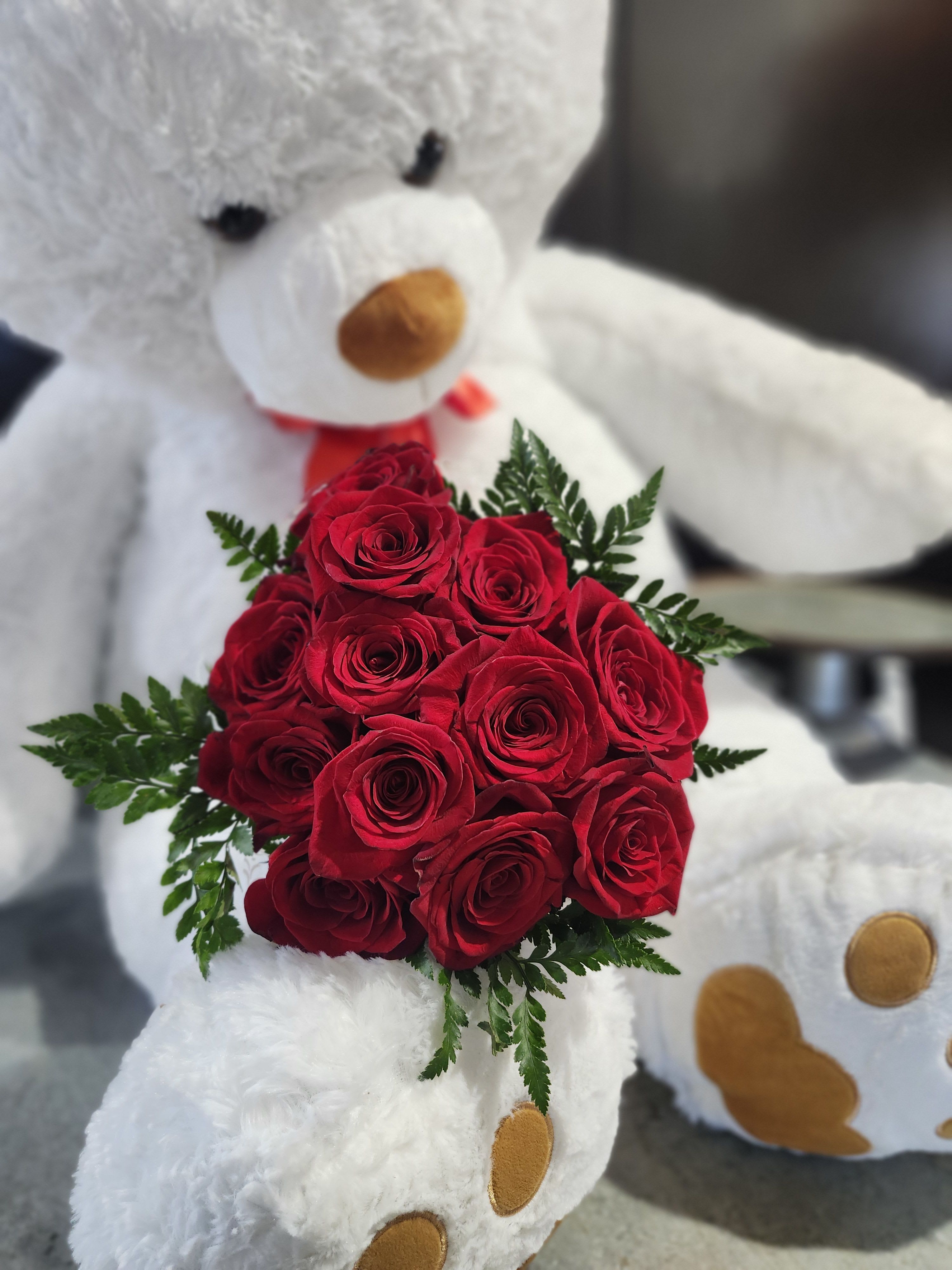 Standard Rose Dozen Wrapped - One Dozen Colored Roses W/ Greenery in a Wrap