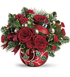 Deck The Holly Ornament by Teleflora with one of a kind arrangement - Ceramic Ornament with hand applied holly leaf accents with a one of a kind Arrangement of mixed red flowers and evergreens. ARRANGEMENT WILL NOT LOOK LIKE THE PICTURE