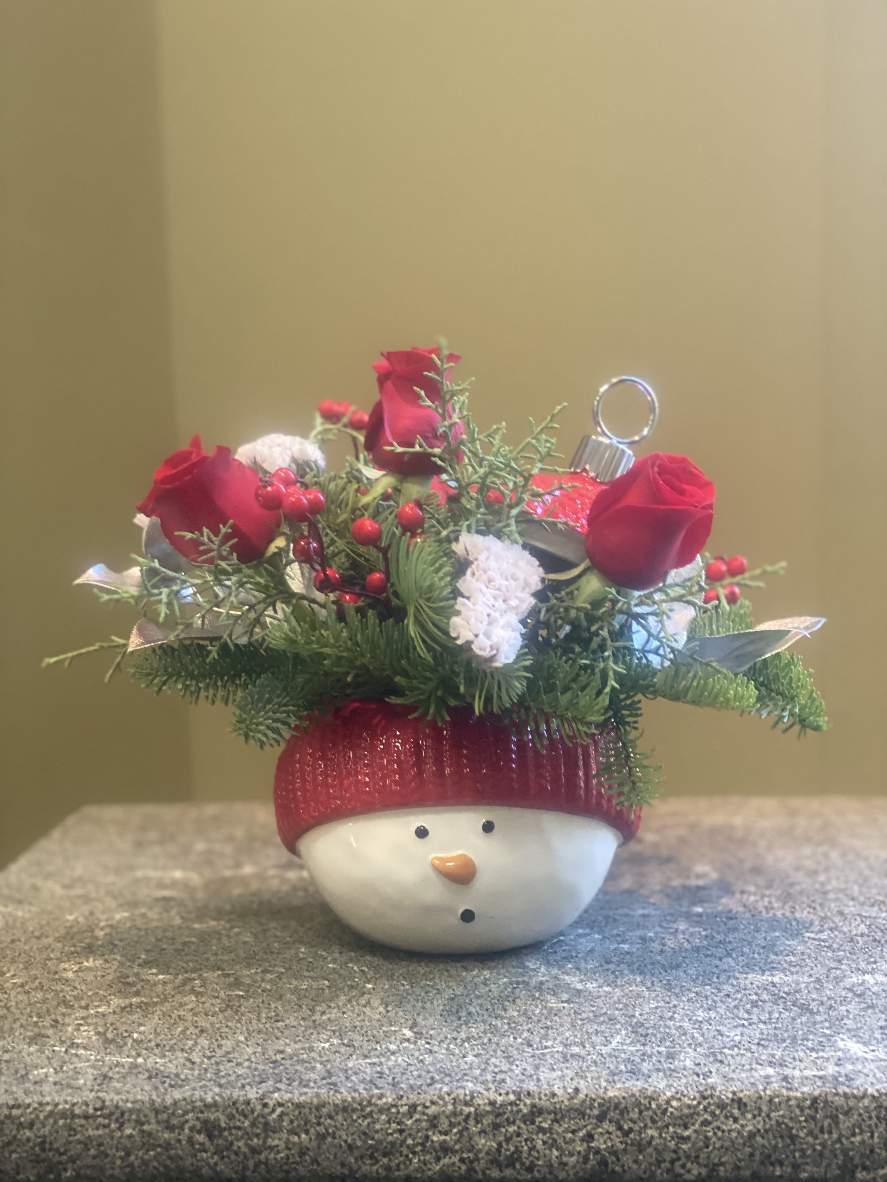 Teleflora Snowman Ornament Bouquet T20X400A - Wonderful ceramic ornament jar with hand glazed finish. Arrangement of red and white flowers to cheer up your holiday season. WILL NOT LOOK  EXACTLY LIKE PICTURE DUE TO AVAILABILITY OF SOME FLOWERS 