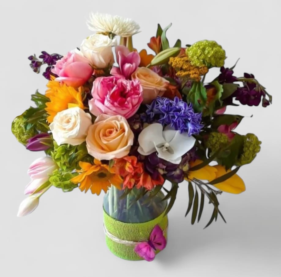 Sending You Joy Designer's Choice - Roses orchids and so much more arranged in a tall modern glass cylinder vase wrapped in pretty citrus jute ribbon. Perfect to send today to show them how much you care. All of my designs are always made extra special and unique each and every time. Please visit my beautiful gallery. Send them happiness today.