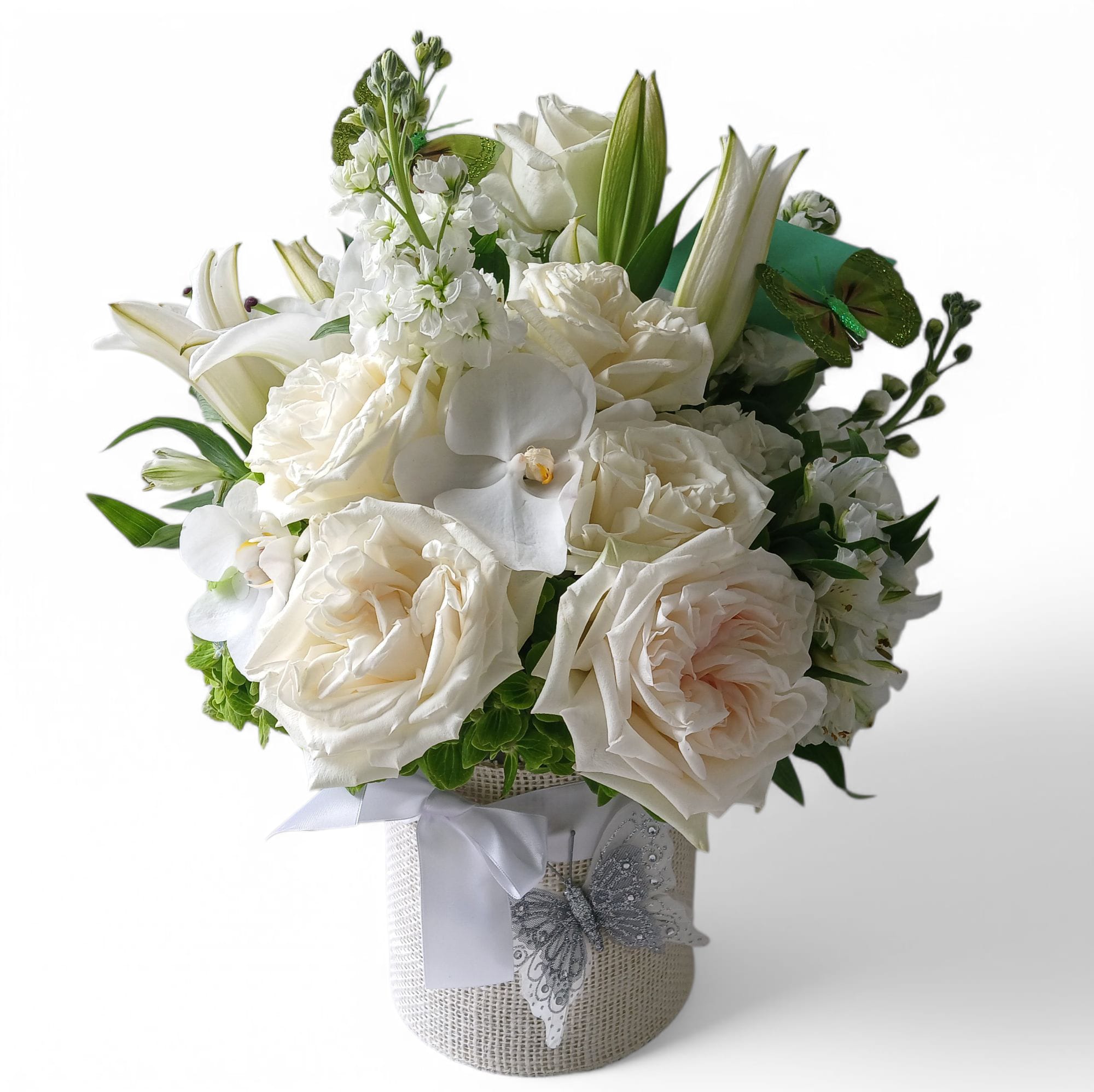 Bella Sympathy Bouquet Designer's Choice | Haddonfield Delivery - Send this beautiful bouquet today filled with roses, orchids, hydrangeas, and lilies arranged in a tall modern glass cylinder vase wrapped in white jute ribbon. Perfect to show them how much you care in their most difficult time. Elegant and thoughtful with innocent white blossoms to help comfort and show caring.  Always made extra beautiful and unique. Send them your deepest condolences. Haddonfield, Haddon Township, Cherry Hill, Marlton, Moorestown, Mount Laurel and Voorhees same-day delivery.