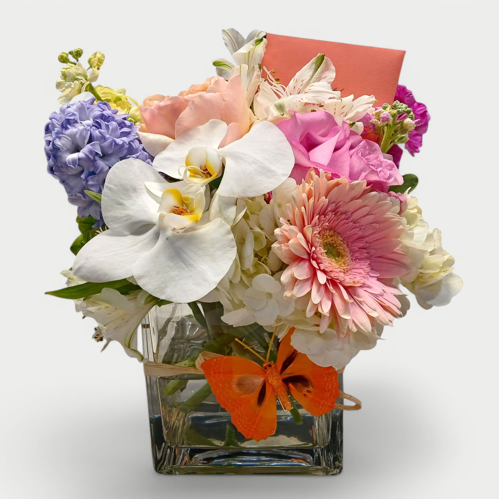 Haddonfield Birthday Bouquet - Send this beautiful Happy Birthday bouquet today to show them how much you are thinking of them. Roses orchids hydrangeas daisies stock and more arranged in a modern glass vase. Beautiful and perfect to make them smile.