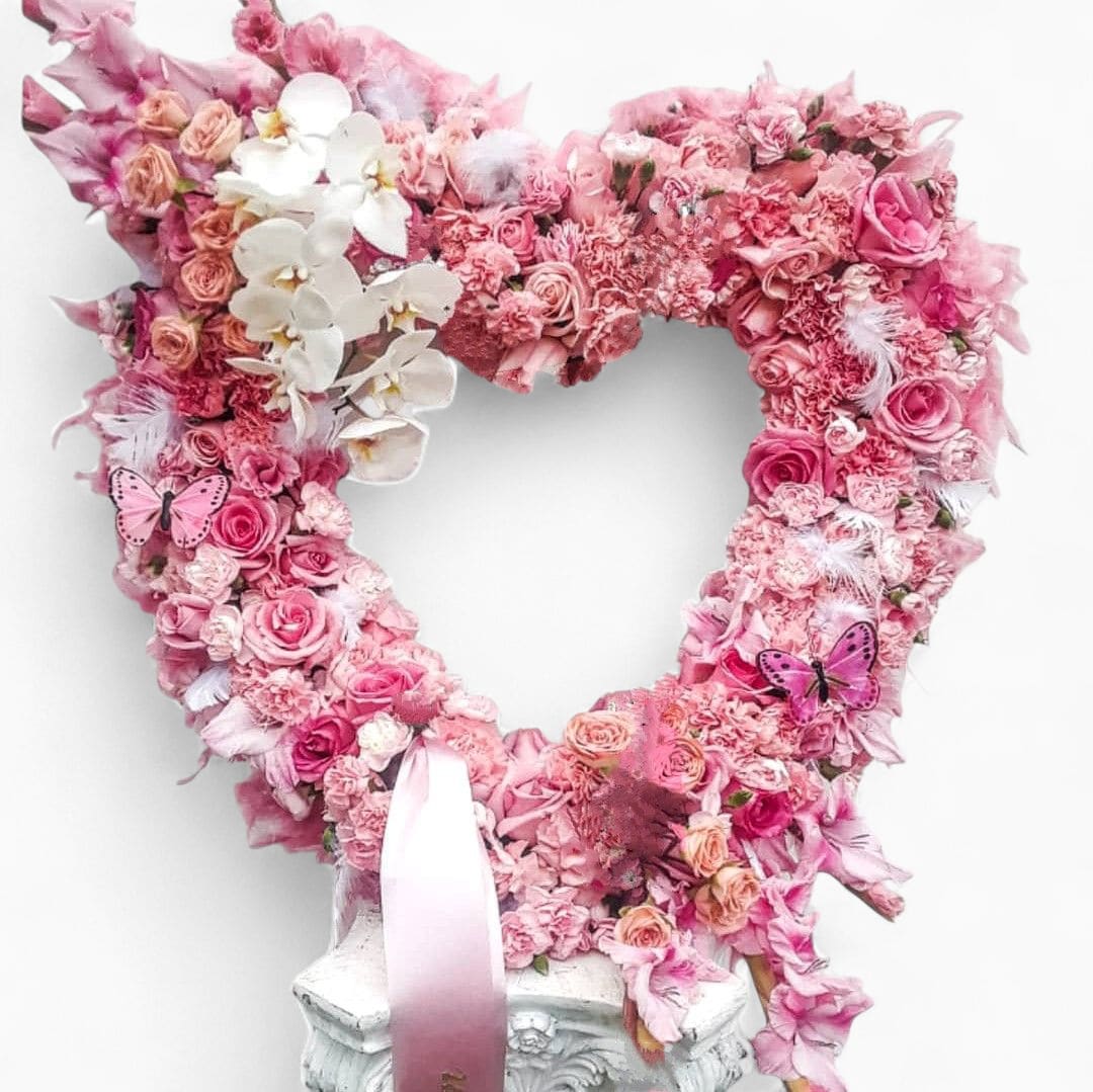Couture Pink Rose Heart Wreath - A couture statement in pink - overflowing with lush fresh roses and premium seasonal blooms, styled into an unforgettable heart wreath.  This is a breathtaking display piece for life's most meaningful moments - created in refined shades of soft pinks, blush and rose and white.  48 - hour notice is required so we can reserve the freshest premium blooms in this exact color palette.