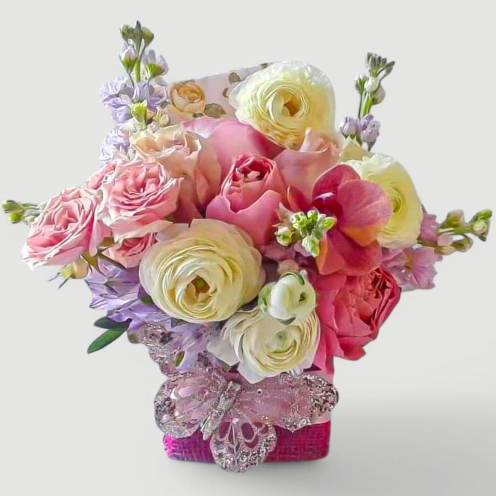 White Pink Rose Bouquet Designer's Choice - Send this pretty pink and white rose bouquet today to make their day with it's lovely mixed white and pink blossoms of the day roses and more arranged in a modern glass cube vase wrapped in hot pink jute ribbon. Perfect to send today for every reason. Always made extra special and unique each time. Send happiness.