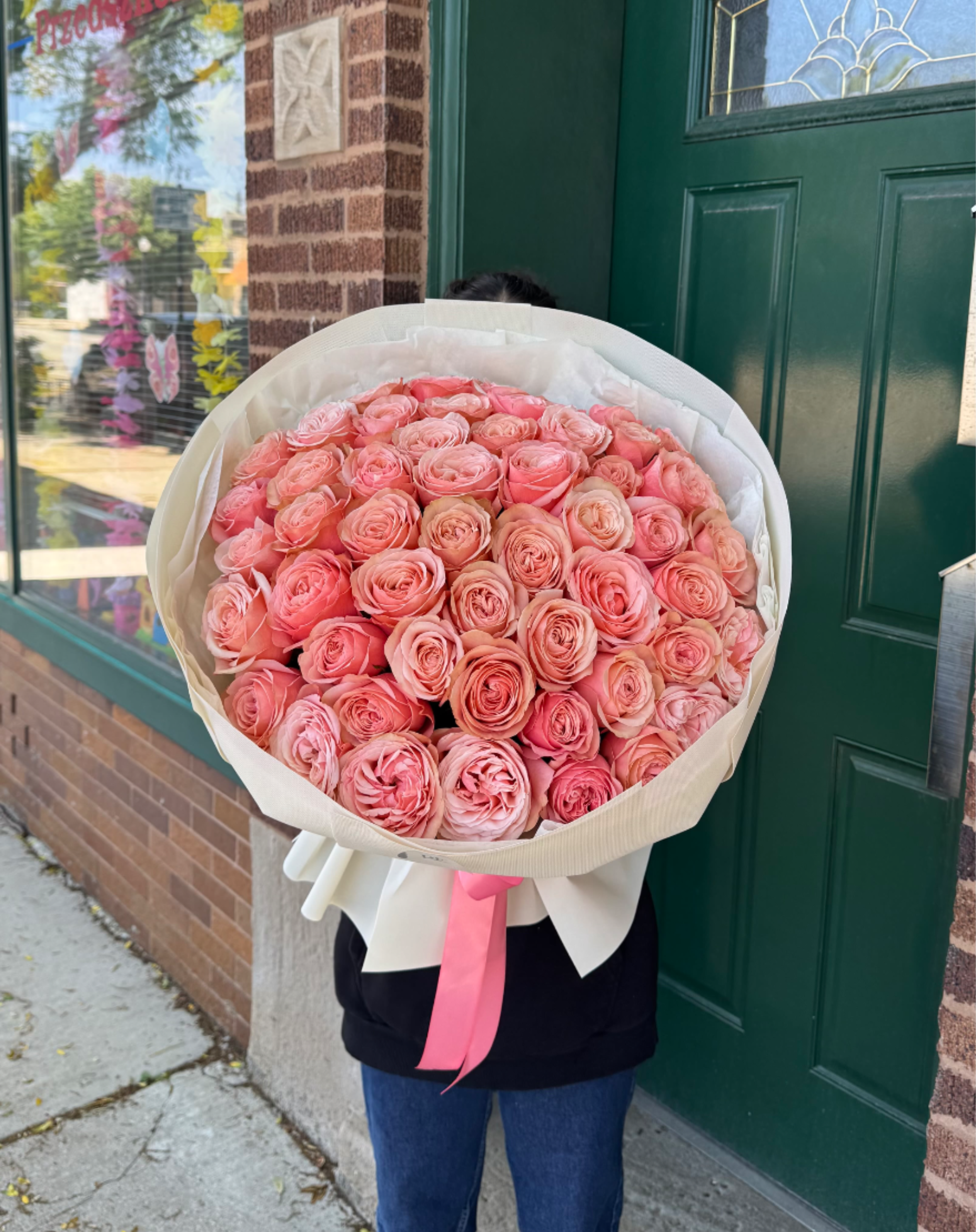 Candy Luxe - A sumptuous mono bouquet of Peachy colored peony-type roses, radiating elegance and bold allure. 