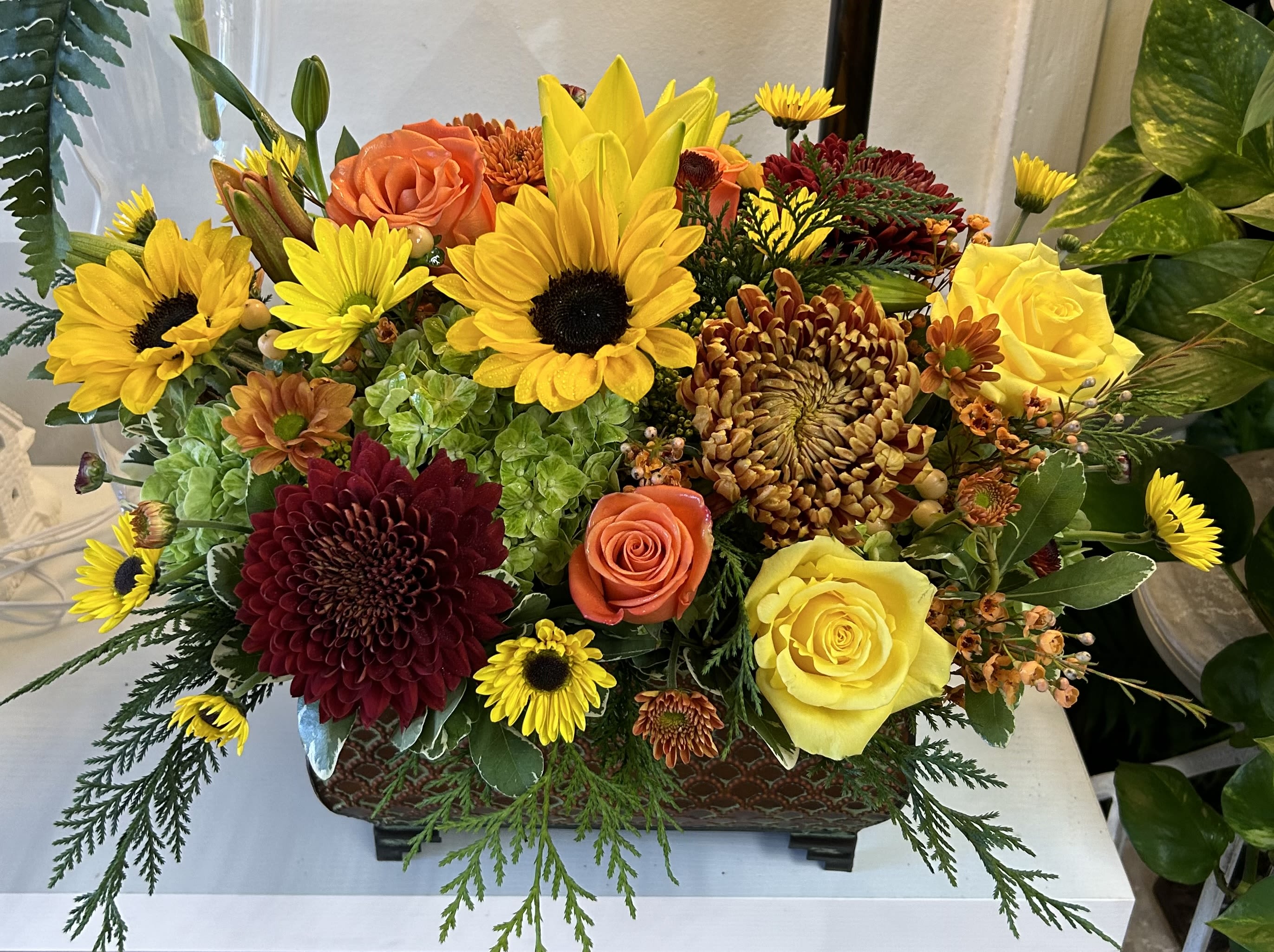 Happy Fall  - A beautiful assortment of premium autumn flowers displayed in a metal container