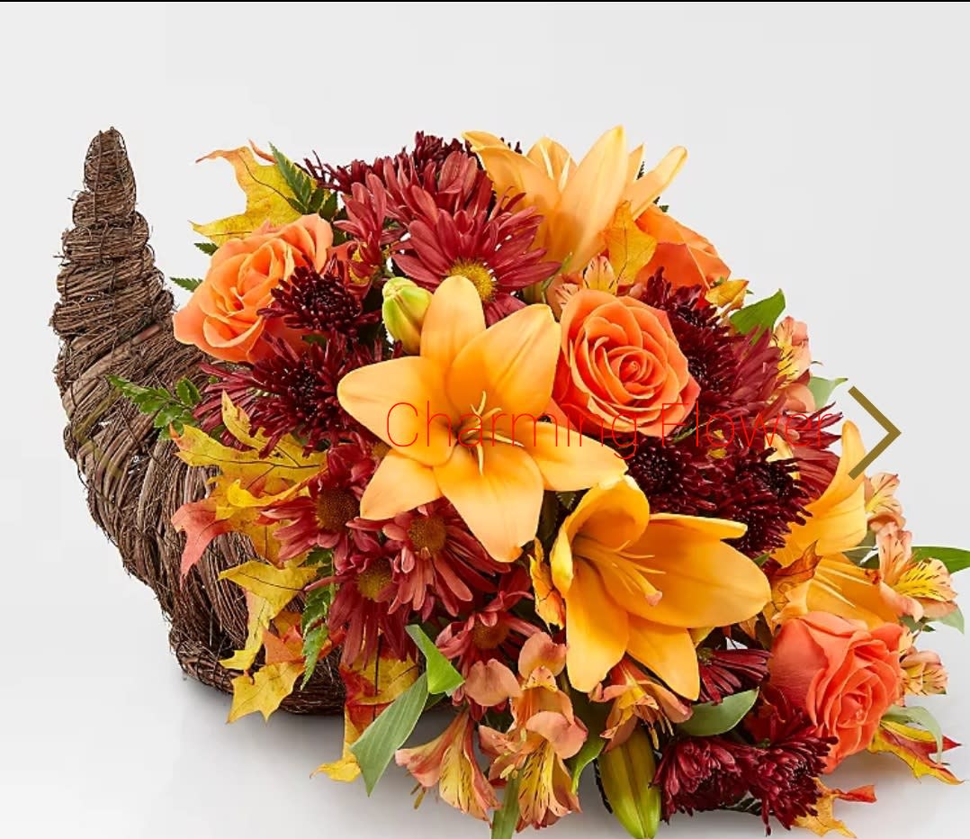 Fall Cornucopia - Our cornucopia basket is full of timeless beauty, designed with lush, fresh-cut evergreens and vibrant autumn accents. It’s a classic centerpiece for gathering together.