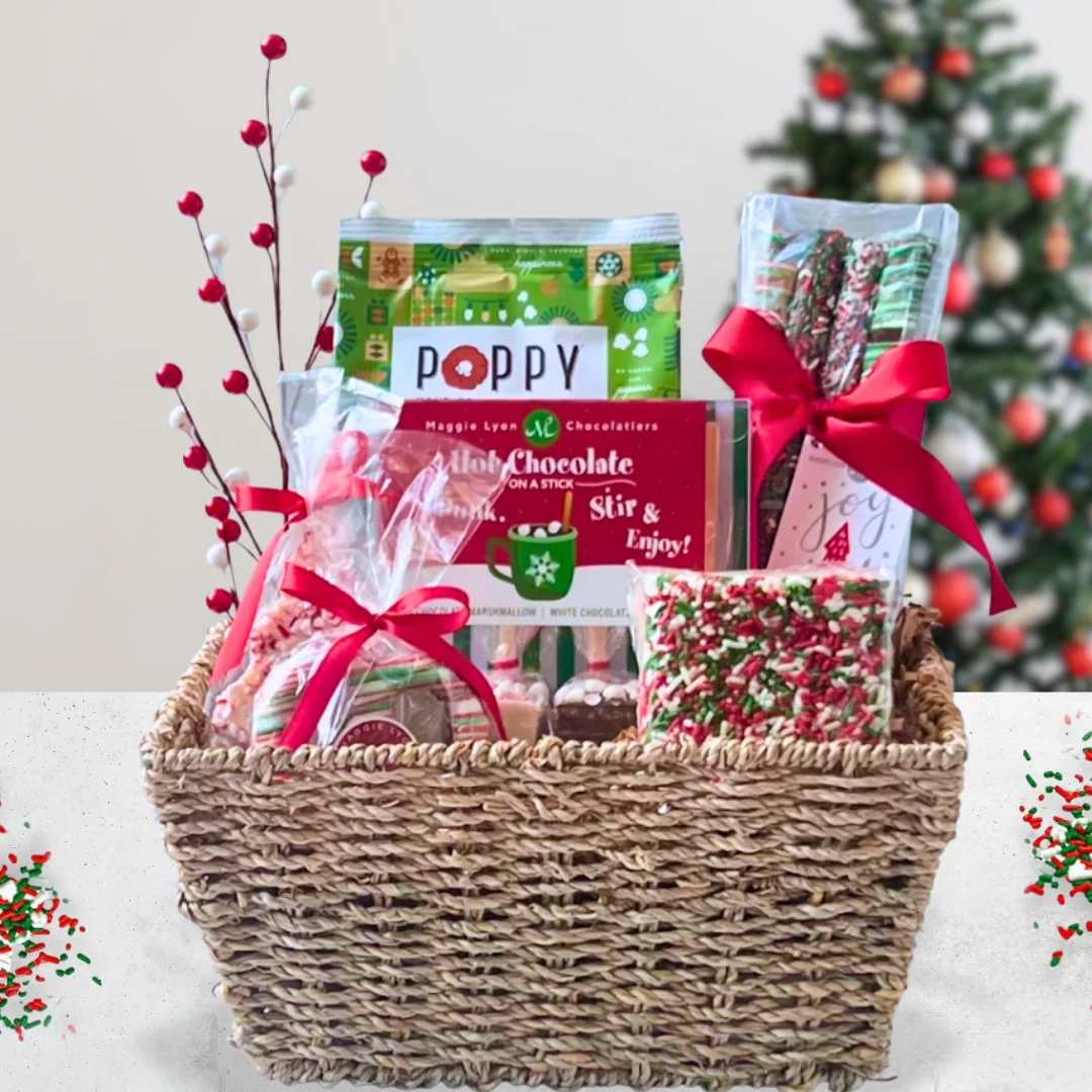 Holiday Treats Grande - Give warm wishes this holiday season with a Christmas basket perfect for sharing with family and friends. An indulgent assortment of festive treats featuring Augusta’s own Watanut Cranstachio Shortbread Cookies.  It also includes white chocolate peppermint and milk chocolate marshmallow hot chocolate on a stick, a holiday sprinkles marshmallow crispy cake, hand-crafted popcorn, Christmas pretzel rods and much more!