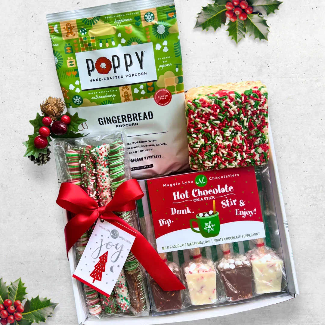 Christmas Treats  - From Augusta Gift Baskets, The Christmas Treats gift box has something for everyone - sweet treats like white chocolate peppermint and milk chocolate marshmallow hot chocolate on a stick, a holiday sprinkles marshmallow crispy cake, hand-crafted gingerbread popcorn and Christmas pretzel rods!
