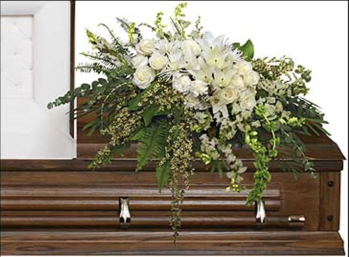 Garden Elegance Casket Spray  - Elegant casket arrangement of white blooms and foliage   A unique arrangement hand created by our experienced designers. Please note that every design is custom made and substitution to container and flower types may happen from time to time. Design aspects will always stay the same, but if needed, we will substitute with flowers of equal or greater value to offer you a great floral shopping experience! Our flowers are 100% guaranteed. Please call us with any questions or concerns.