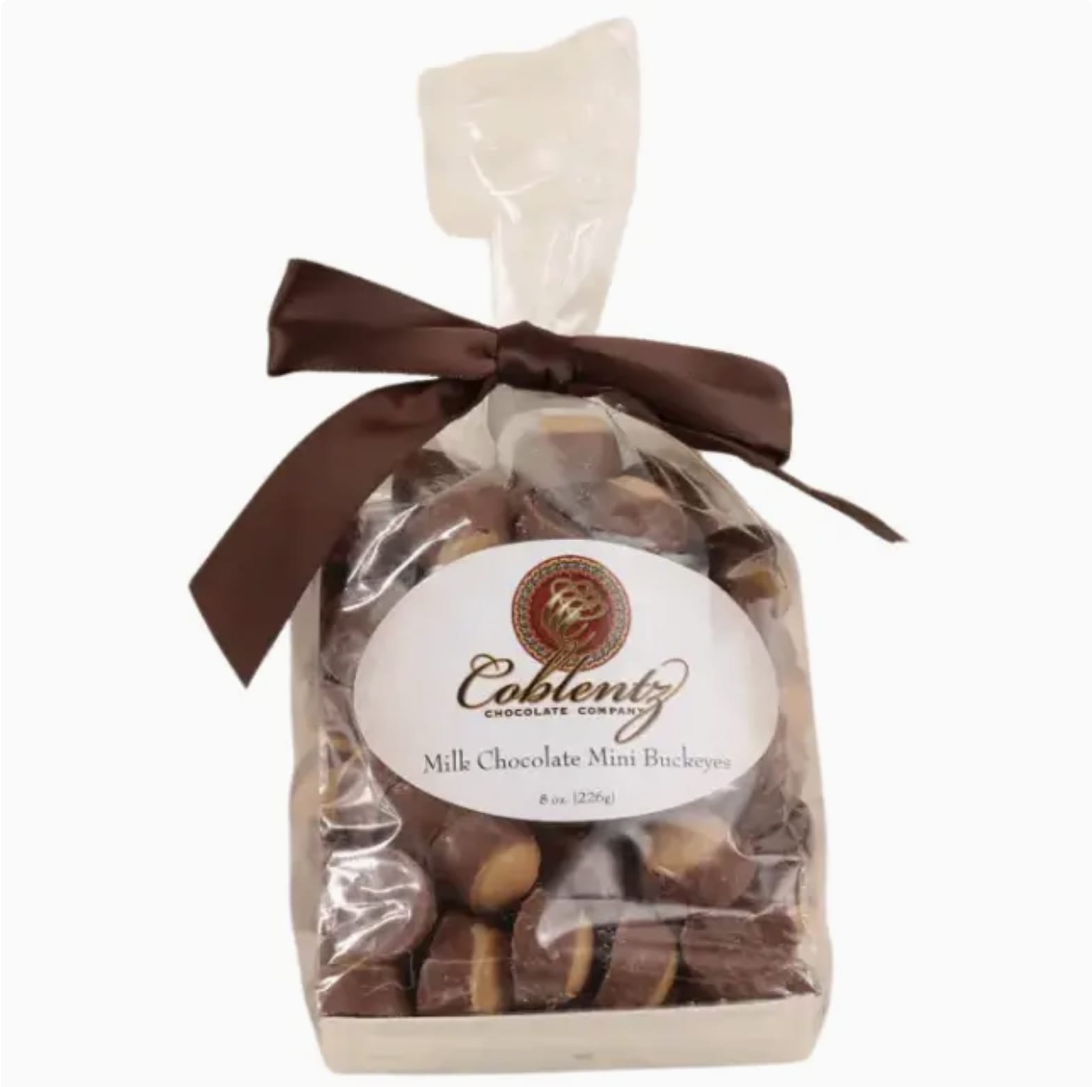 Mini Buckeye Balls Bag  - A classic favorite in bite-sized form! Creamy peanut butter centers dipped in smooth milk chocolate make these mini buckeyes an irresistible snack. Perfect for parties, gifting, or keeping on hand whenever the craving strikes.  *Please Note: We offer free gift wrap on all gift item orders! There is no purchase minimum for pick up. For delivery there is a minimum combined limit of $39.00.
