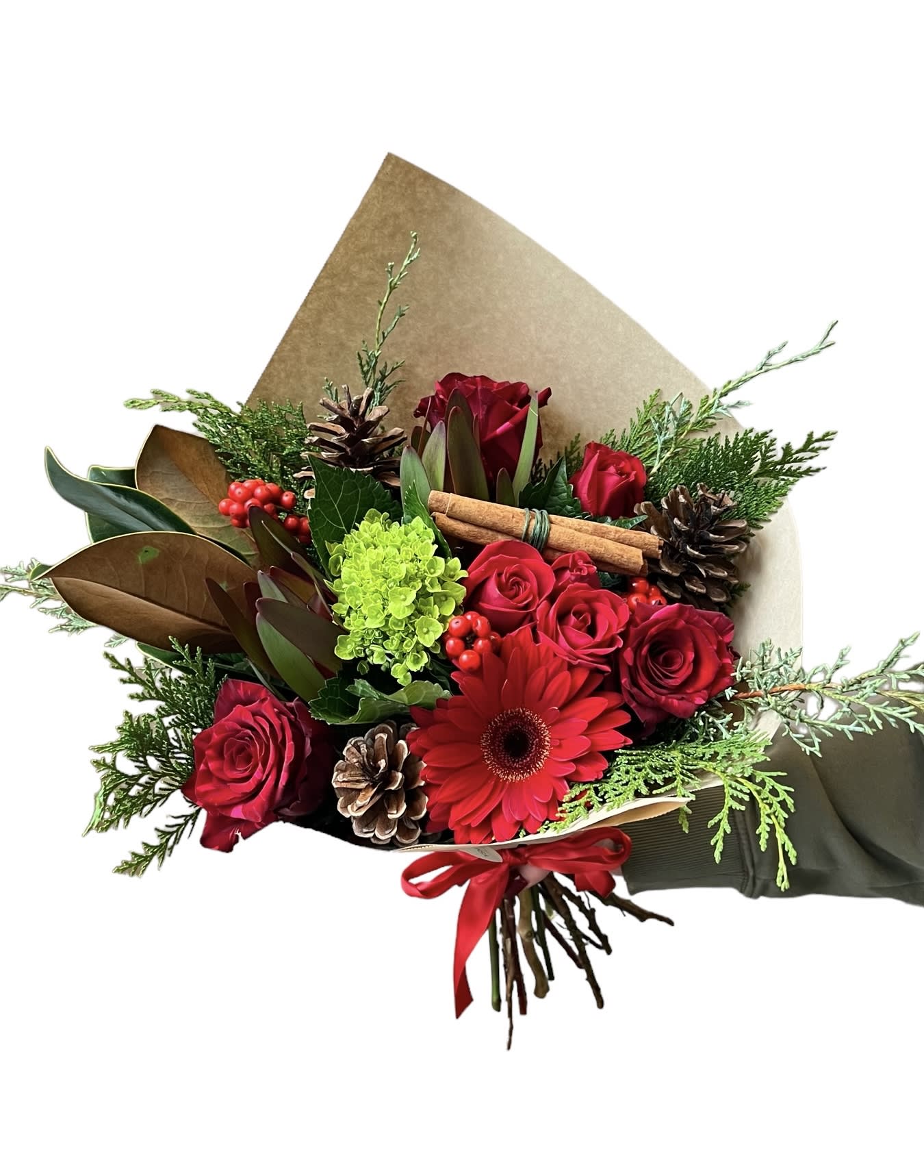Red &amp; Green Holiday Bouquet - Red roses, red spray rose, red berries, green hydrangea, red gerbera daisy, red filler, with Christmas greens and pinecones wrapped in brown paper with a red bow. As shown in photo. VASE IS NOT INCLUDED