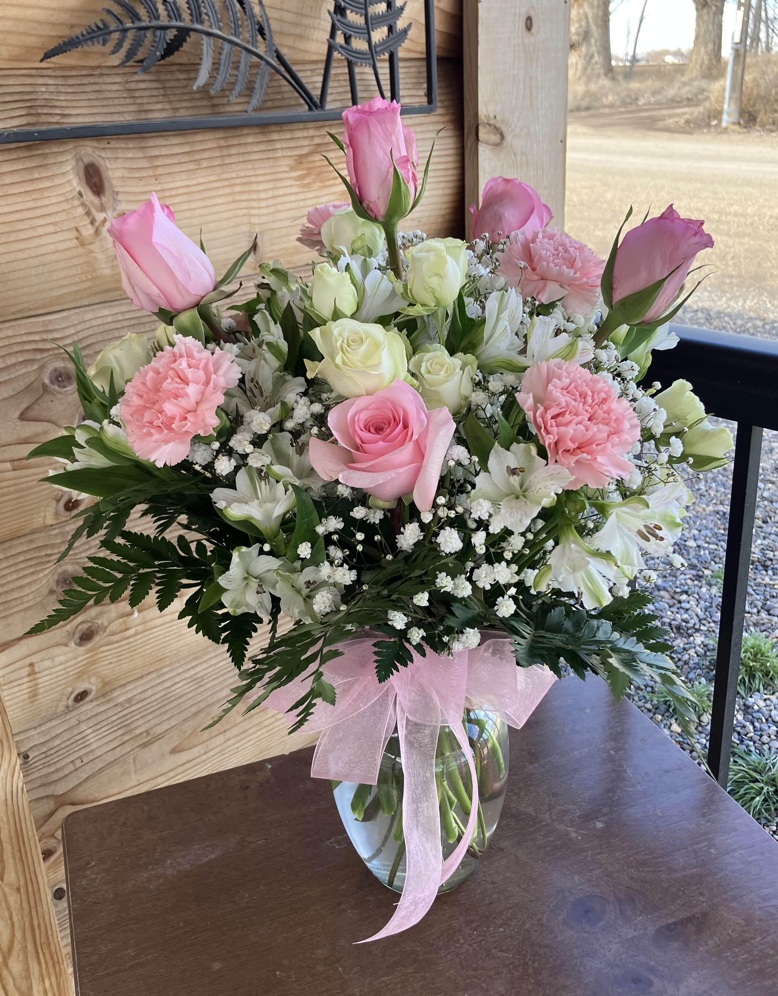 Pink And White Rose Bouquet With Carnations - This bouquet has pink and white roses, pink carnations and baby's breath . This bouquet would be great for a birthday or just because!