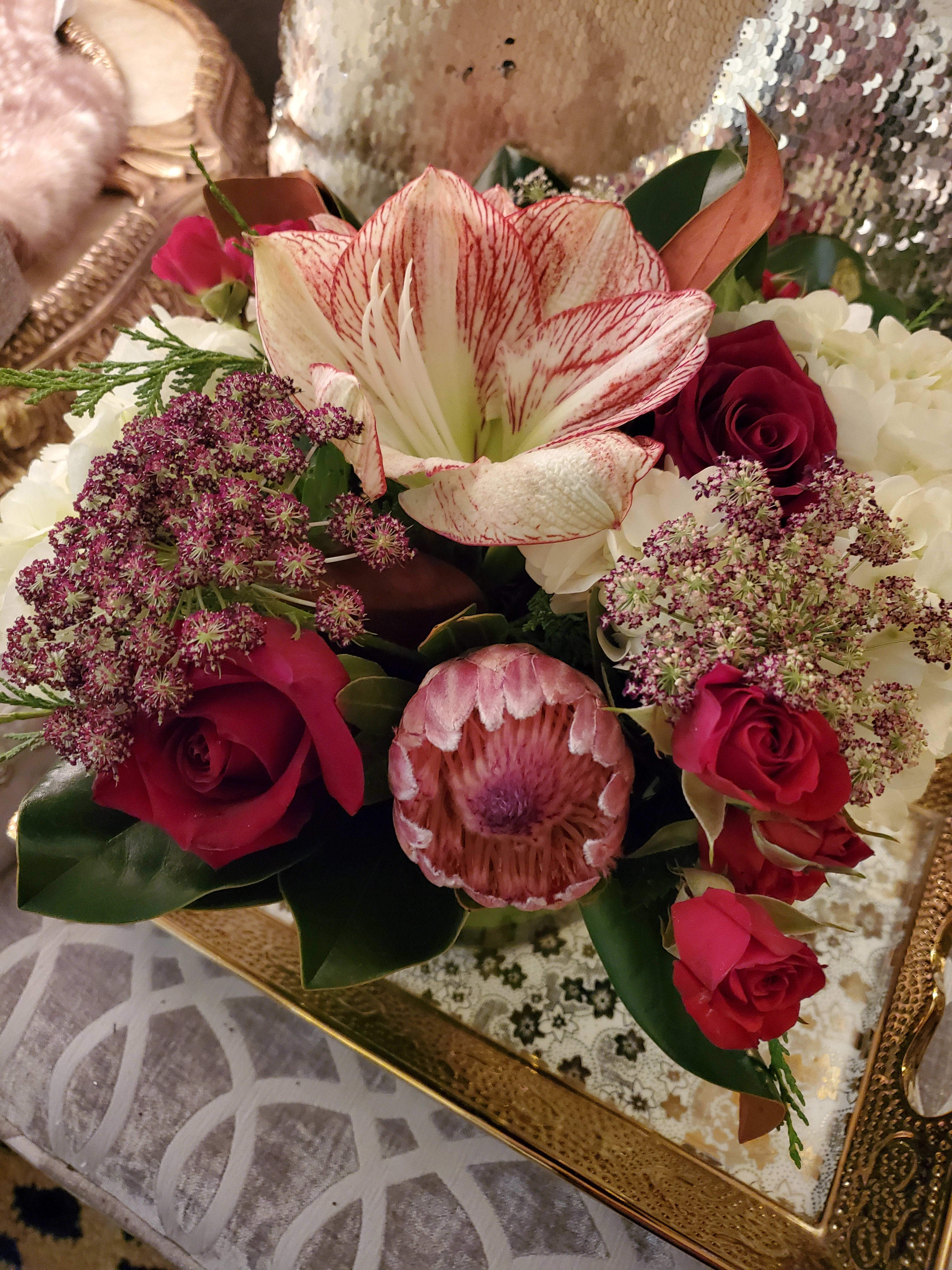 Oprah Winfrey - A gorgeous display of amaryllis, roses, hydrangeas, and cedar.