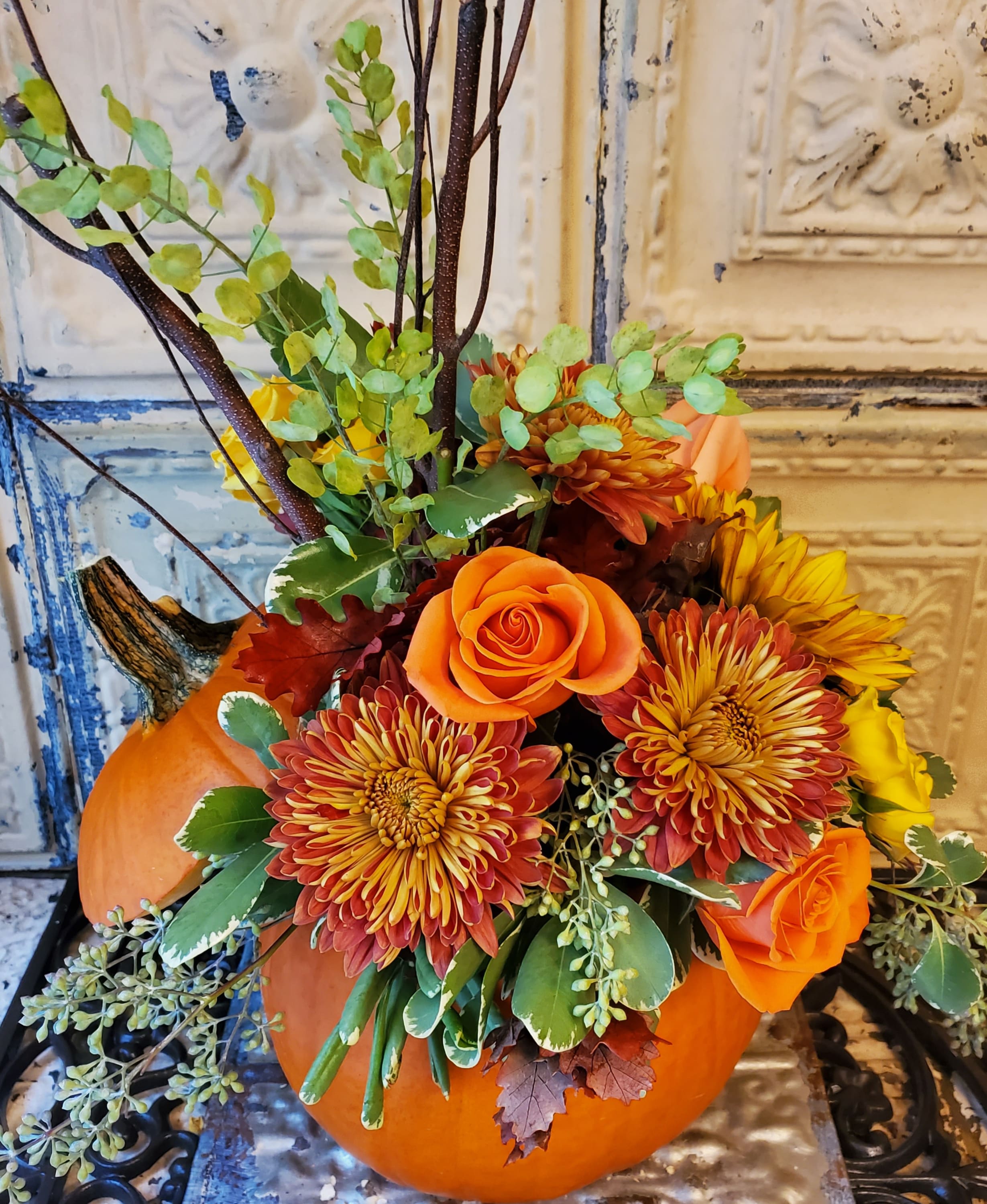 William Shakespeare  - Celebrate autumn with this unique, must-have centerpiece of Roses, Mums, Seeded Eucalpytus, Pittosporum, Penny Cress, and Birch Branches. The best part? It's sitting in a fresh, live pumpkin!