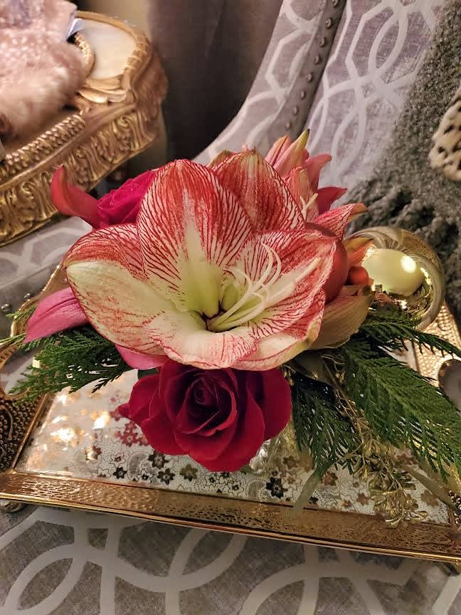 George Michael - A delightful holiday arrangement of amaryllis, roses, lilies, seeded eucalyptus, cedar, and Christmas ornaments.