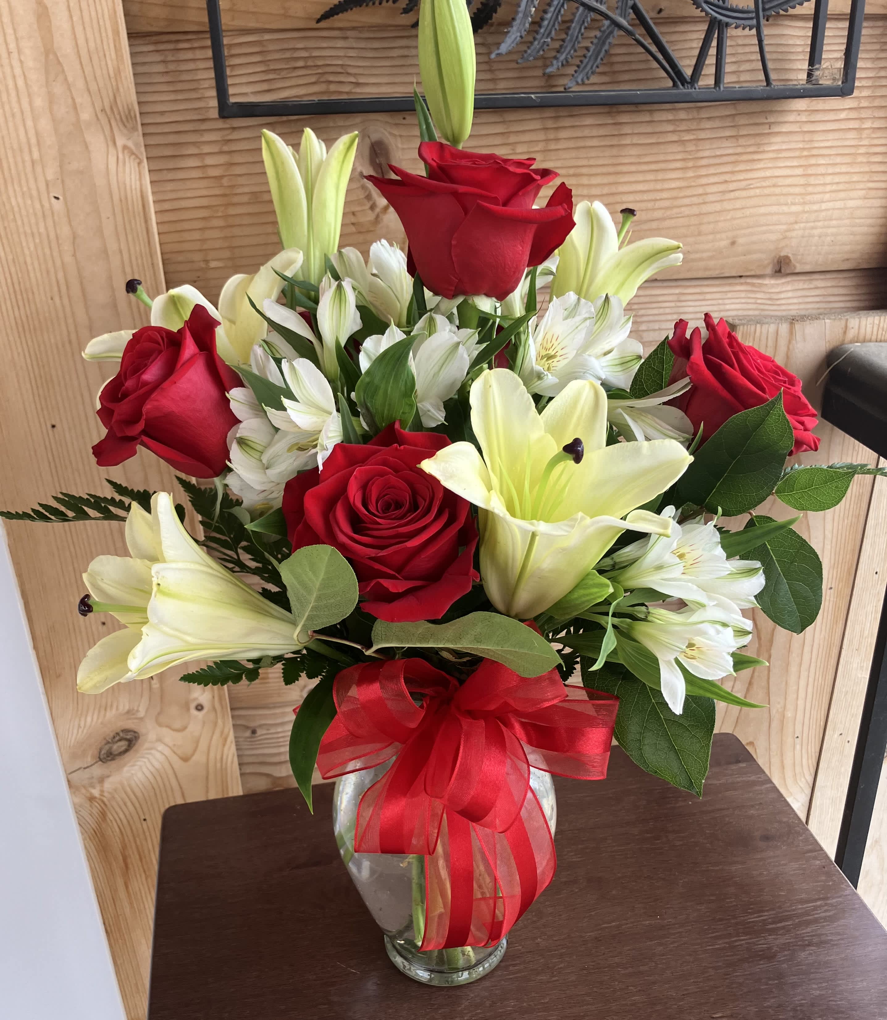 XOXO - This lovely half dozen arrangement will get you XOXO's!