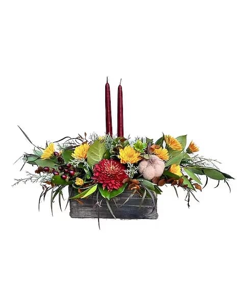 Burgundy Fall - This centerpiece is a 9 inch box with burgundy candles beautiful addition to any table.  Due to the nature of perishable products, some floral products may require minor substitutions. We'll contact you if drastic substitutions are required.