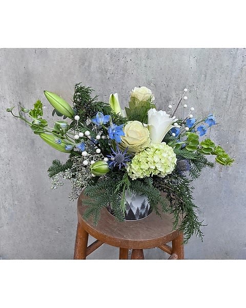 Blue Christmas  - White rose lilies with bells  Due to the nature of perishable products, some floral products may require minor substitutions. We'll contact you if drastic substitutions are required. All prices in USD ($)  Standard  HF-F174