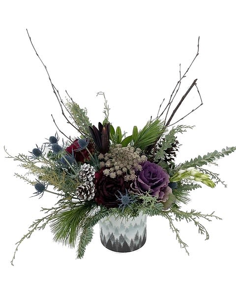 Into the Woods  - This wintery arrangement is composed with red roses, burgundy lily, burgundy peony, purple kale, safari sunset, blue thistle and other greens.  Due to the nature of perishable products, some floral products may require minor substitutions. We'll contact you if drastic substitutions are required. All prices in USD ($)  Standard  HF-F112